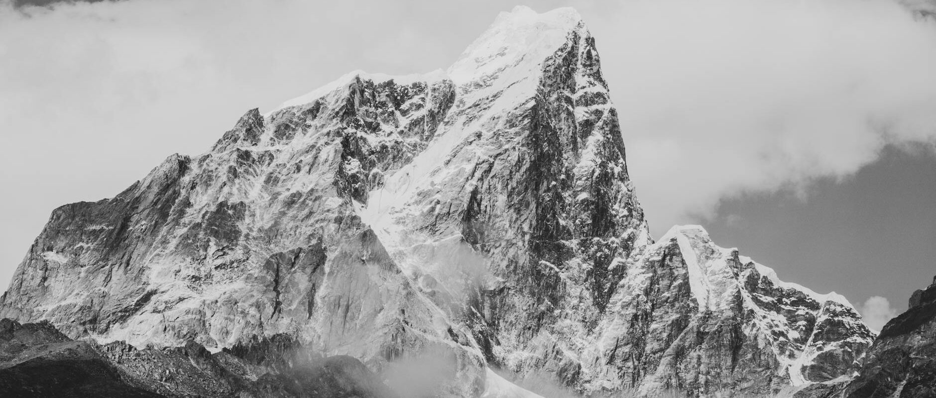 grayscale photo of snow covered mountain