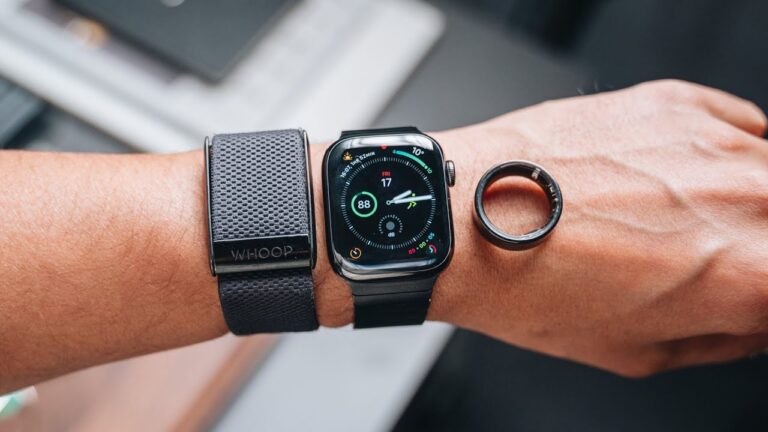Whoop band, Apple Watch and Oura ring worn on the same wrist